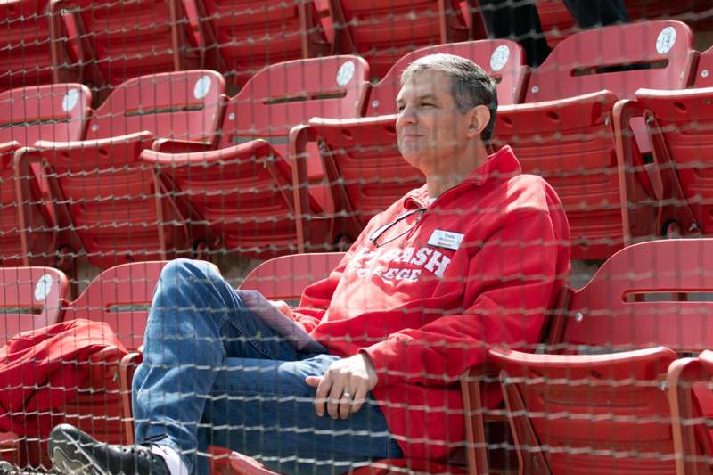 a man sitting in a stadium