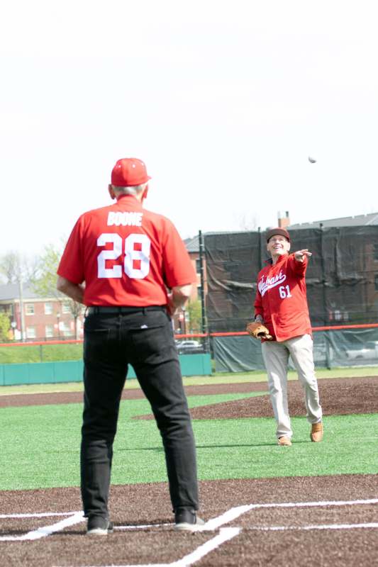 a man throwing a baseball