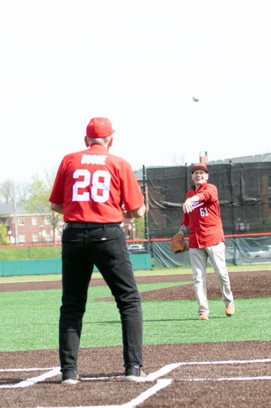 a man throwing a baseball