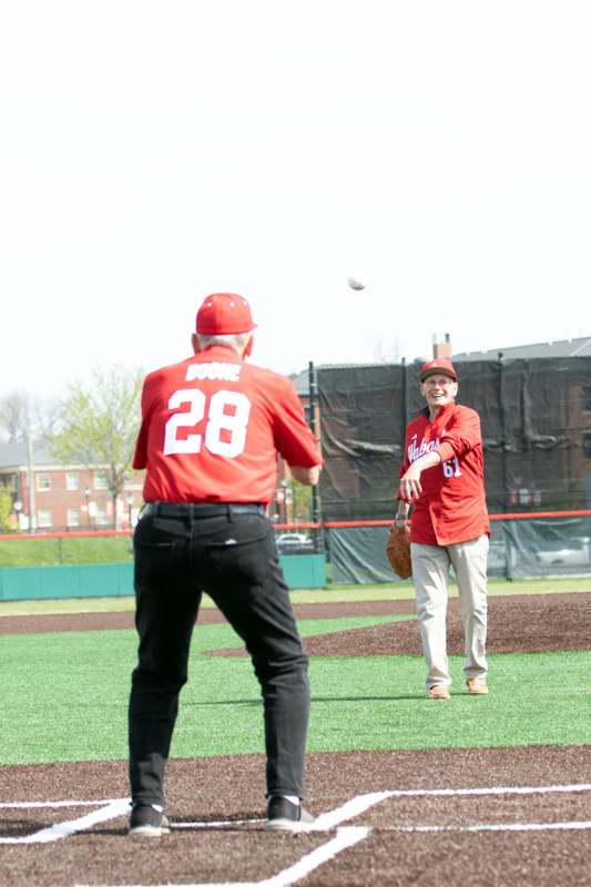 a man throwing a baseball