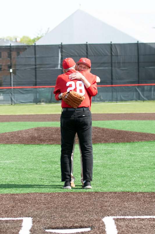 two men hugging on a field