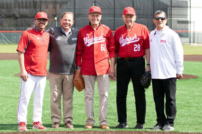a group of men standing on a field