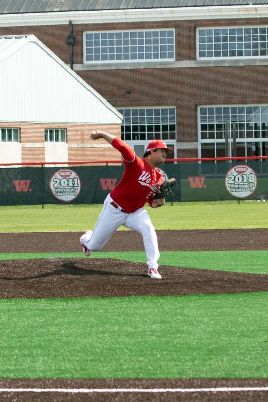 a baseball player throwing a ball
