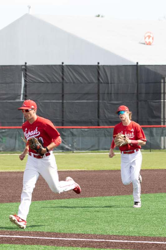 a group of men playing baseball