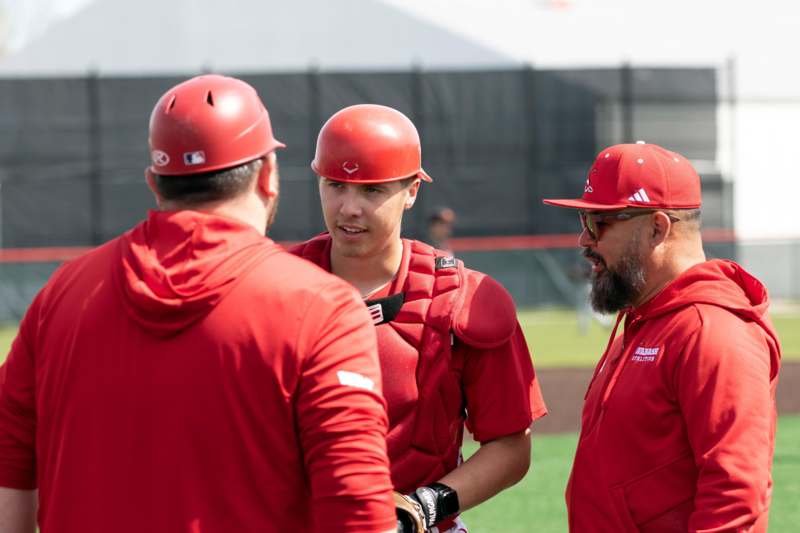 a group of baseball players talking