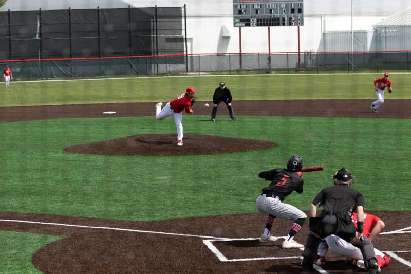 a baseball player throwing a ball