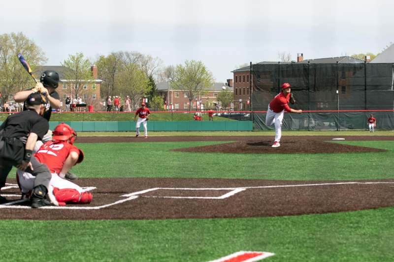 a baseball player swinging a bat