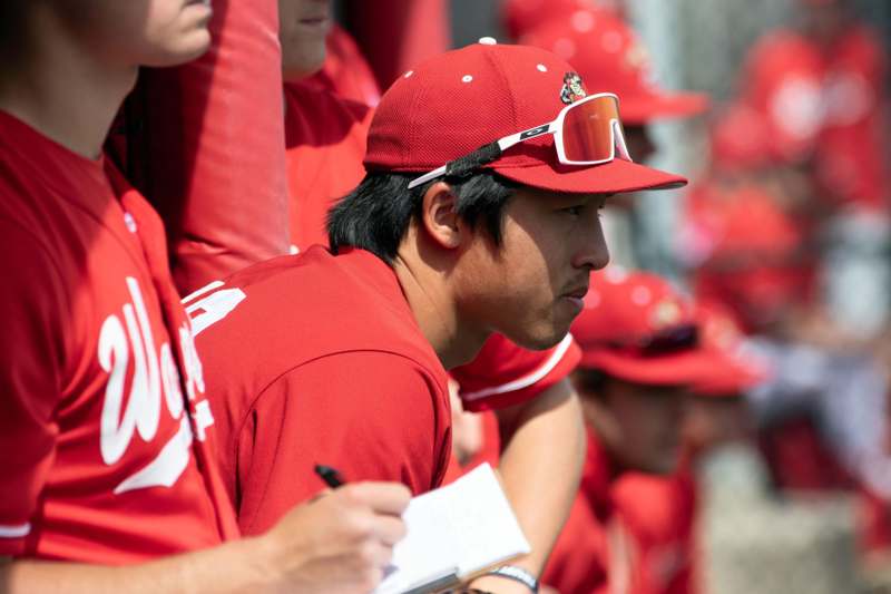 a baseball player in red uniform