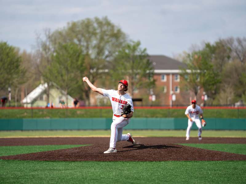 a baseball player throwing a ball