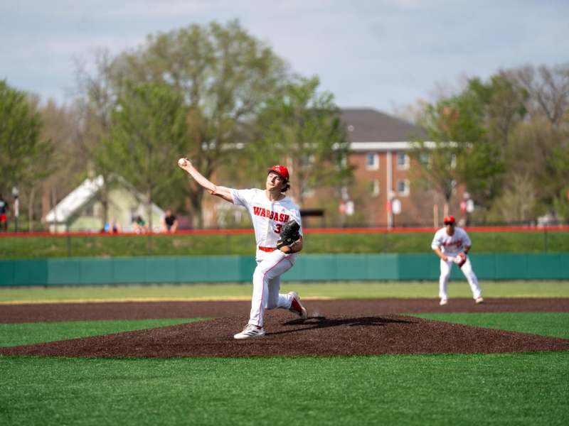a baseball player throwing a ball