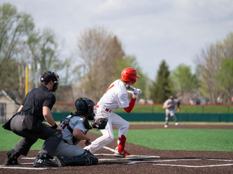 a baseball player swinging a bat