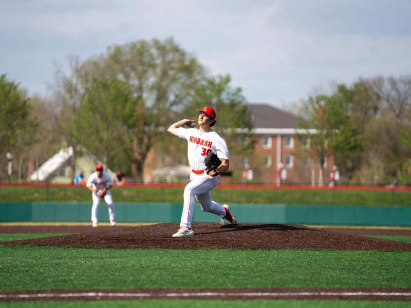 a baseball player throwing a ball