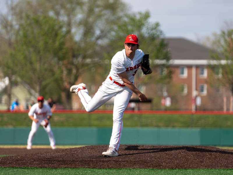 a baseball player throwing a ball