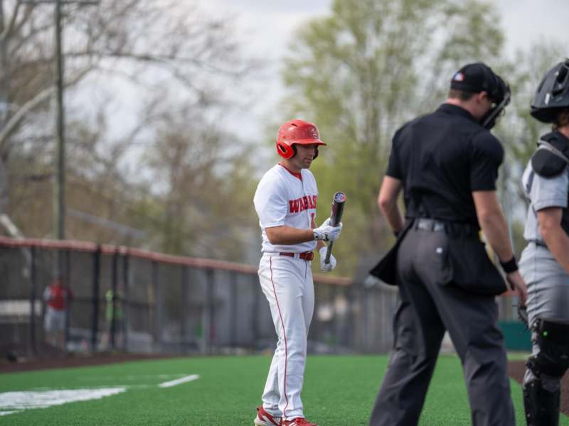 a baseball player holding a bat