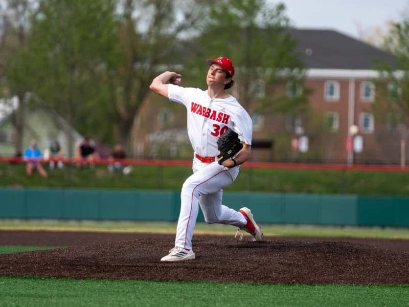 a baseball player throwing a ball