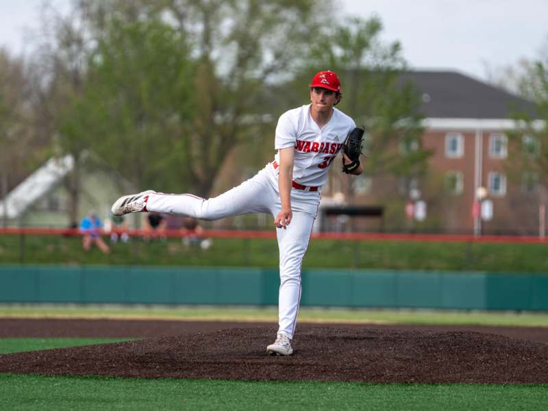 a baseball player throwing a ball