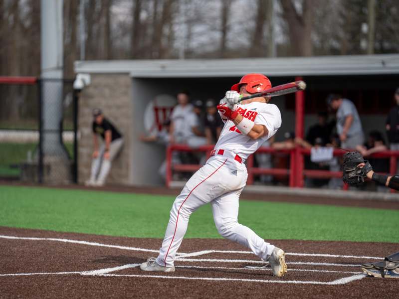 a baseball player swinging a bat