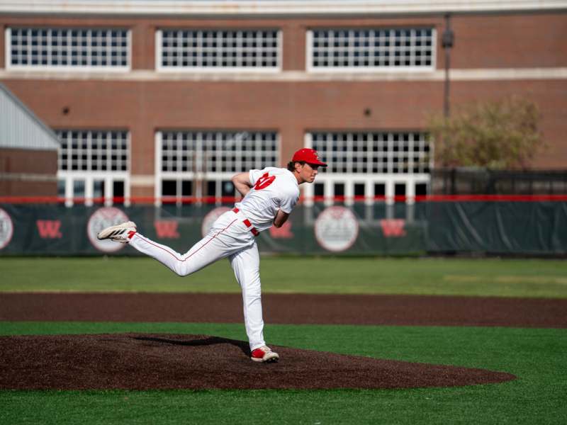 a baseball player throwing a ball