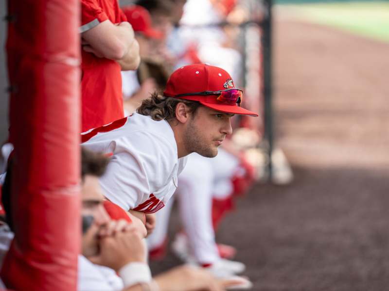 a baseball player in a red hat