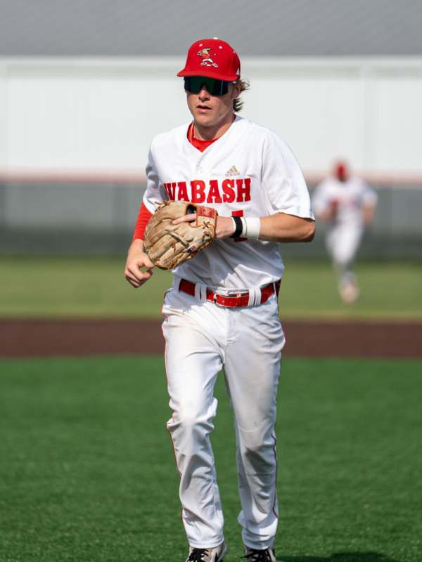 a baseball player running on a field