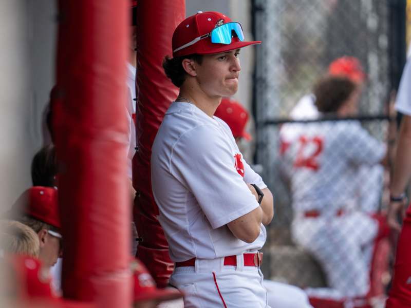 a baseball player in a red hat
