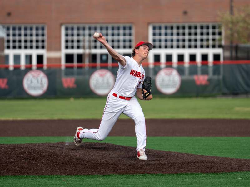a baseball player throwing a ball
