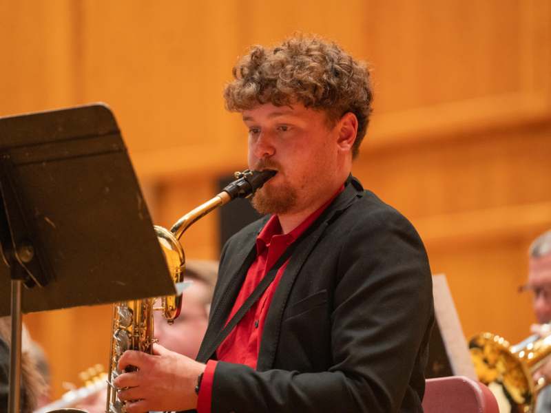 a man playing a saxophone