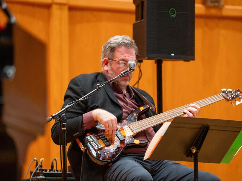 a man playing a guitar