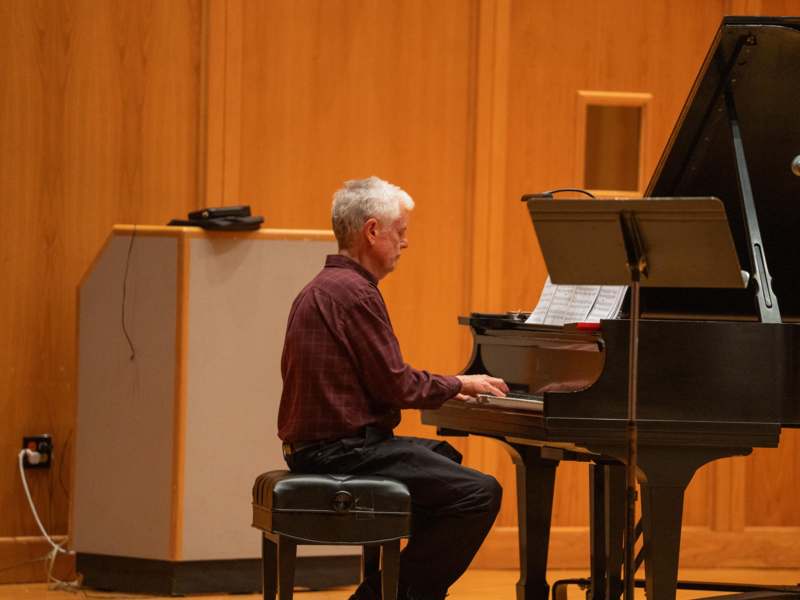 a man playing a piano