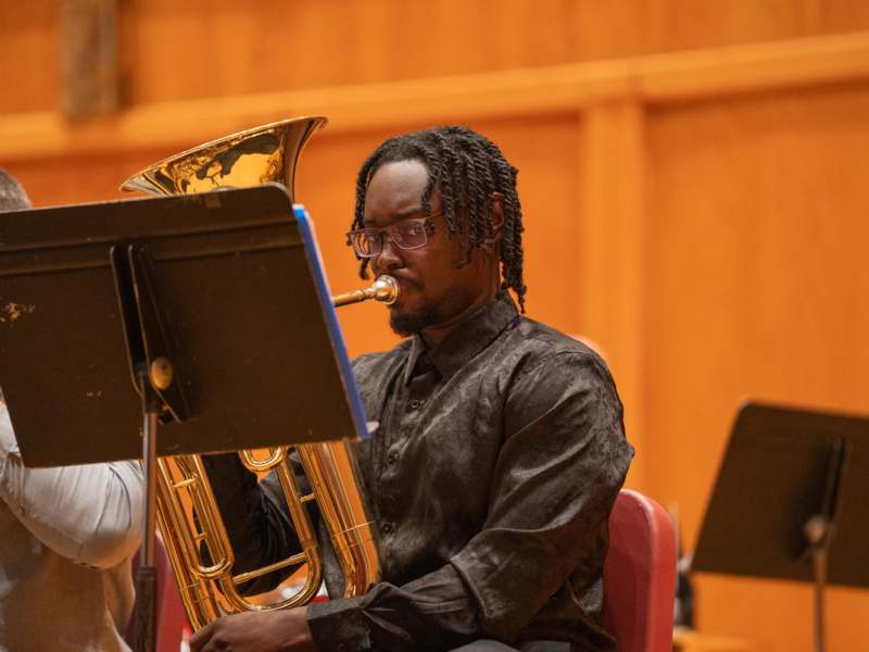 a man playing a horn
