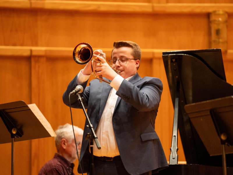 a man playing a trumpet