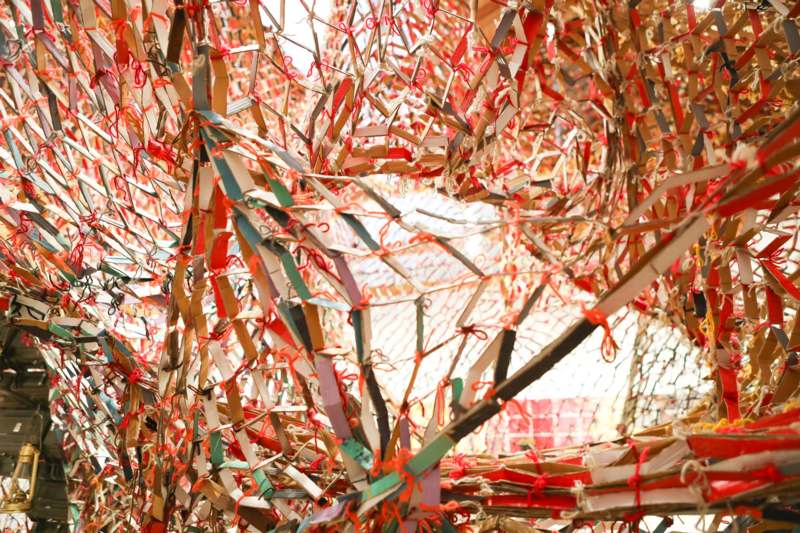 a group of boxes tied together with red string