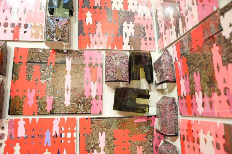 a wall with many pieces of paper