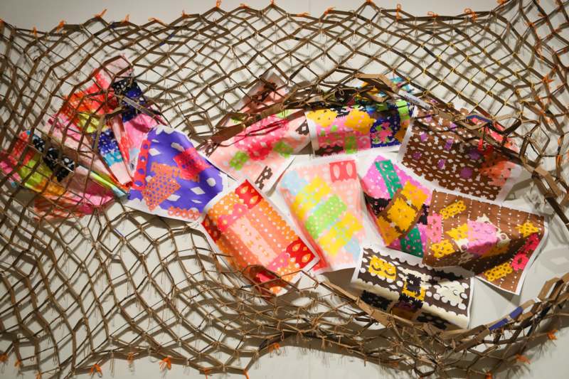 a net with pieces of paper on it