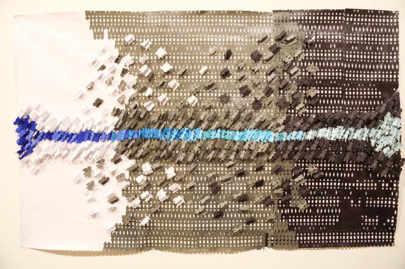 a piece of art made of small pieces of paper