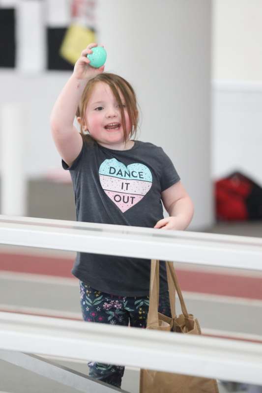 a girl holding a toy