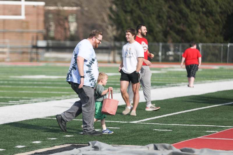 a group of people on a football field