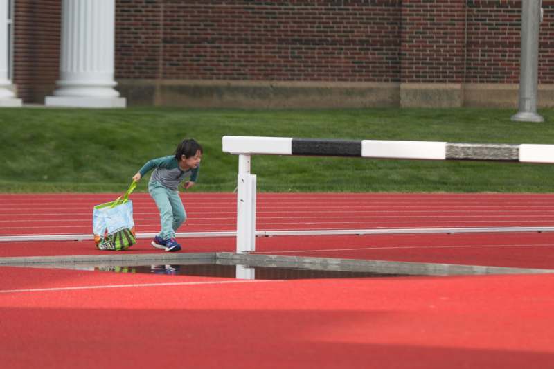 a child running on a track