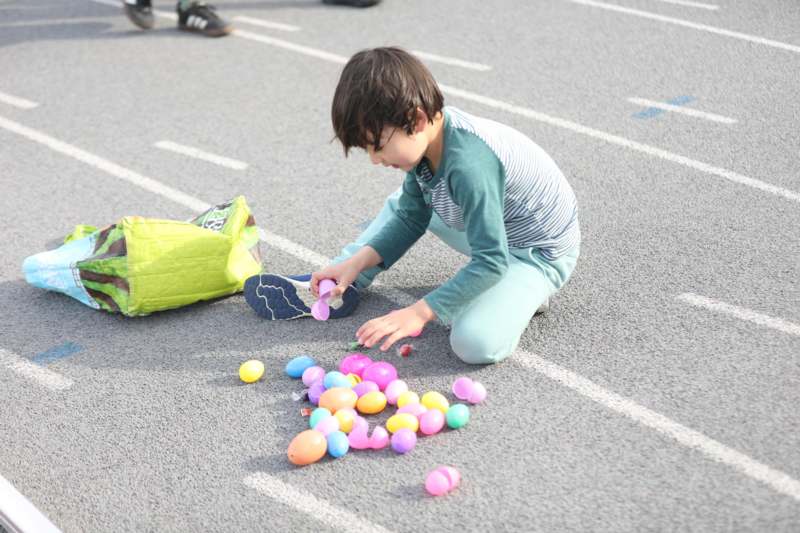 a child playing with plastic eggs
