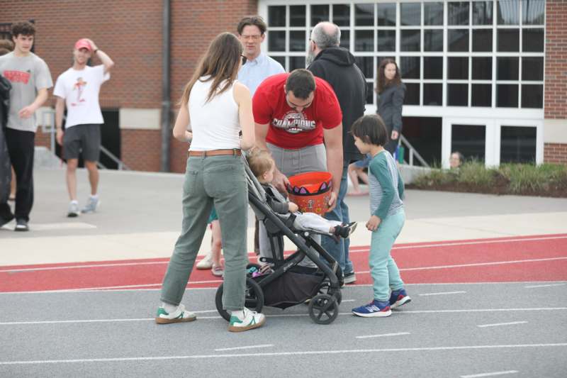 a man pushing a baby in a stroller