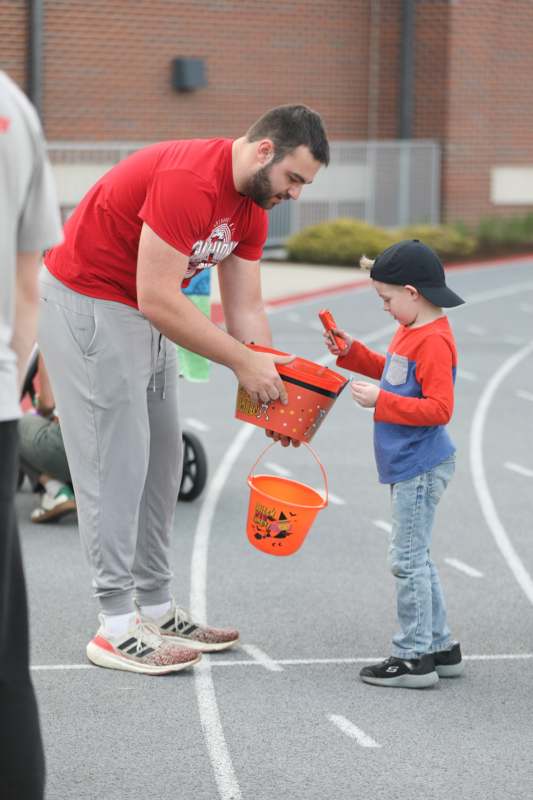 a man and child holding buckets