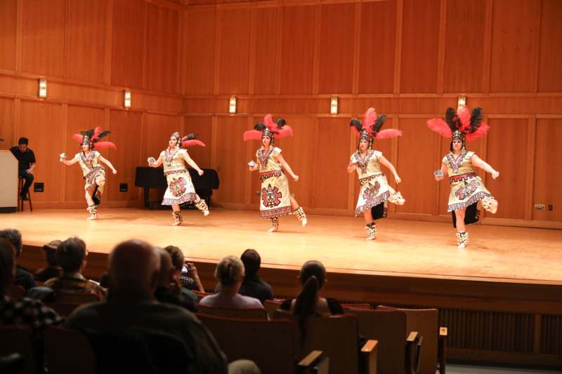 a group of women performing on a stage