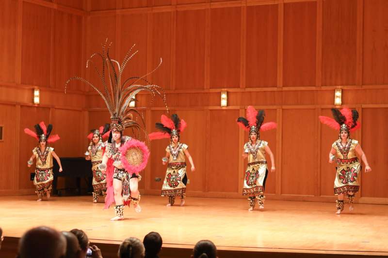 a group of people in clothing on a stage
