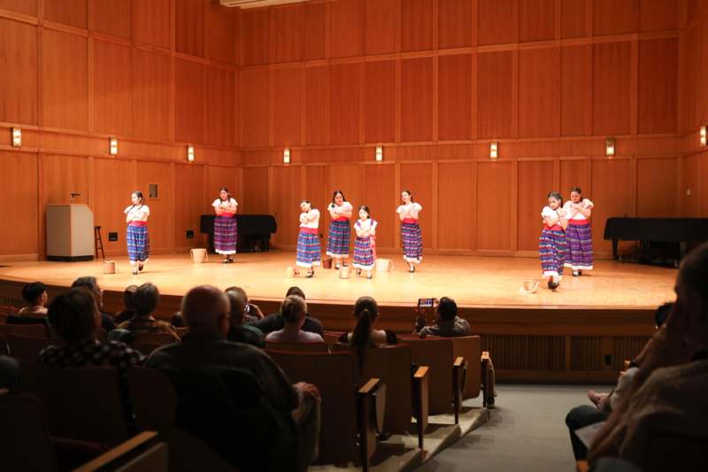 a group of girls performing on a stage