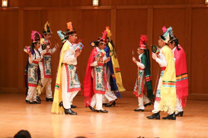 a group of people wearing colorful clothing