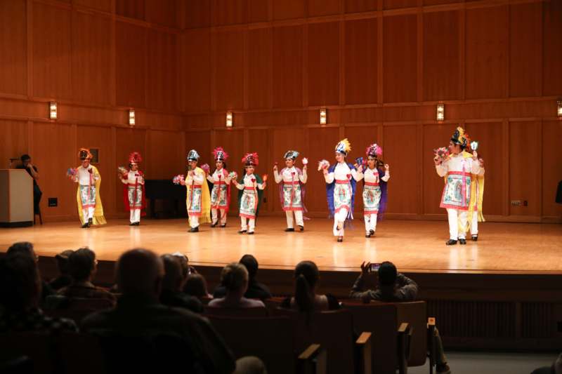 a group of people in clothing on a stage