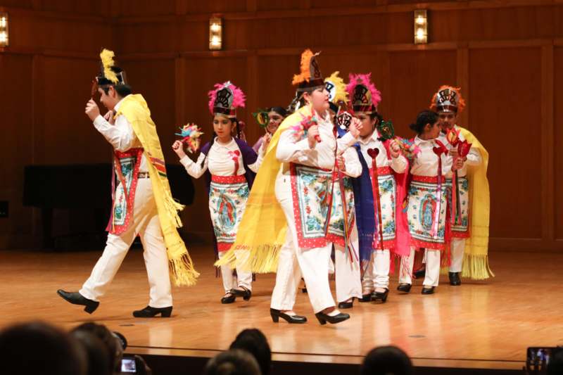 a group of people wearing colorful clothing