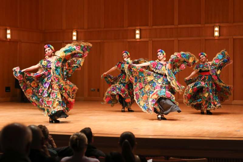 a group of women dancing on a stage