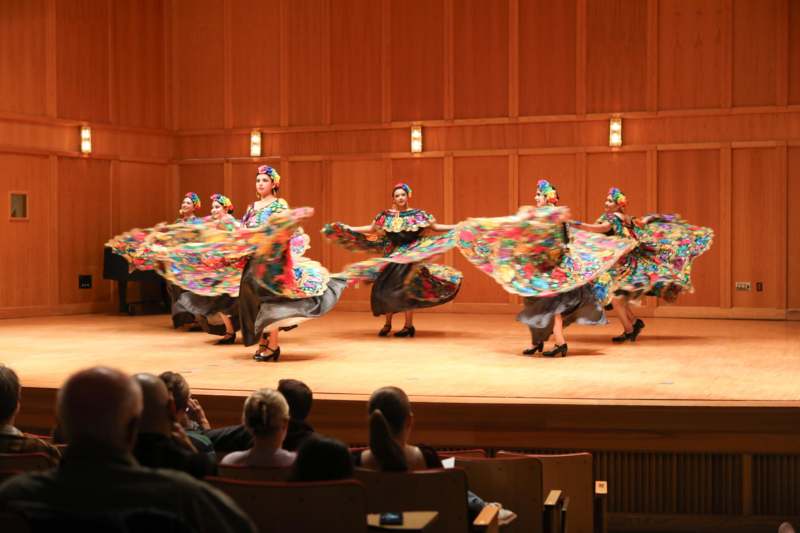 a group of women dancing on a stage