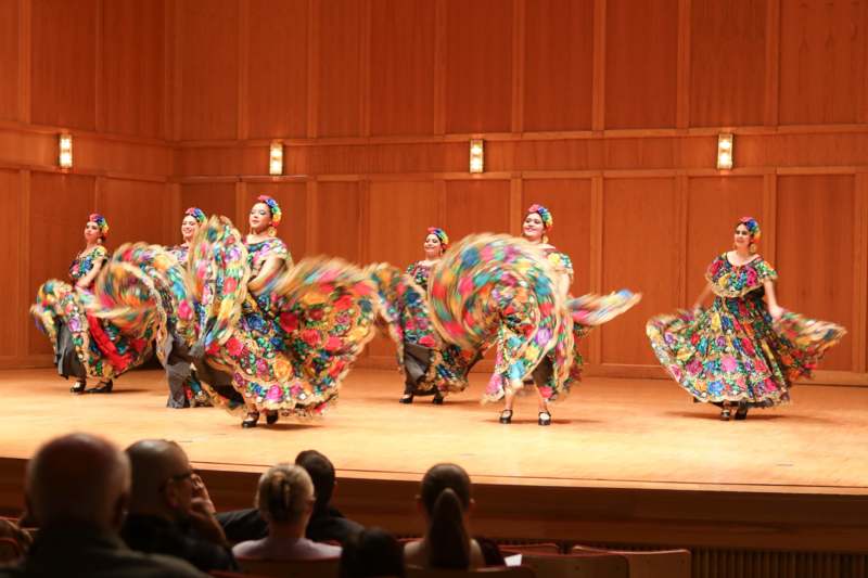 a group of women dancing on a stage